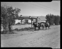 Vacationers on horseback in the desert en route to breakfast with The Desert Riders, Palm Springs vicinity, 1936