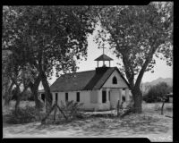 Chapel beneath large trees, Palm Springs, 1934
