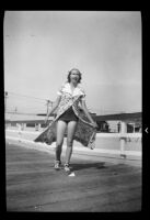 Carolyn Bartlett on a boardwalk on the Balboa Peninsula, Newport Beach, 1937