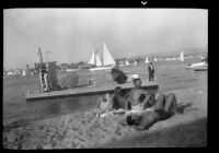 Sunbathers on Balboa Peninsula with a view of Newport Bay, Newport Beach, 1937