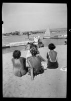Three girls watching a diver from Balboa Peninsula at Newport Bay, Newport Beach, 1937