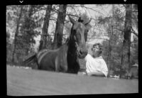 Carolyn Bartlett with a horse on vacation, 1937