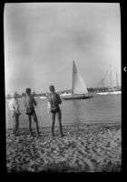 Men watching a sail boat in Newport Bay, Newport Beach, 1937
