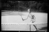 Carolyn Bartlett playing tennis, 1937