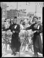 Young women with floral bicycles at the Annual Ocean Park Children's Floral Parade, Santa Monica, 1936