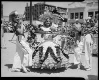 Floral participant representing California with drum majorettes at the Annual Ocean Park Children's Floral Parade, Santa Monica, 1936
