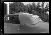 Convertible automobile with weathered top