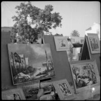 Landscape paintings on pegboard displays at a Santa Monica Art Association exhibition, Santa Monica, circa 1965