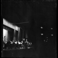 Conductor James Low (probably) and soprano Marilyn Mayne (probably) with an orchestra, 1965