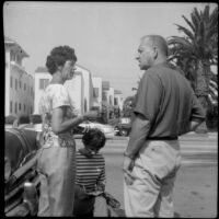 Artist talking to a man on Ocean Avenue, Santa Monica, circa 1965