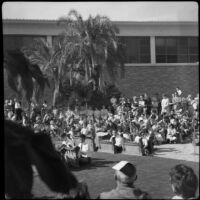 Crowd assembled outside Perloff Hall at UCLA, Los Angeles, circa 1960