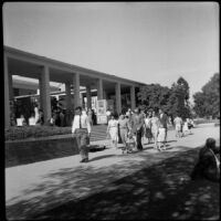 People strolling past the courtyard of Perloff Hall at UCLA, Los Angeles, circa 1960