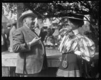 Photograph of Inez Schrodt and L.W. Betler enjoying a beverage at the annual Fiesta de Santa Monica, Santa Monica, 1931