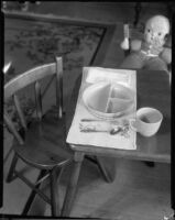 Child's place setting and doll at the Children's Home Society, Los Angeles, 1935-1960