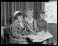 Girls singing from a song book at the Children's Home Society, Los Angeles, 1935-1960