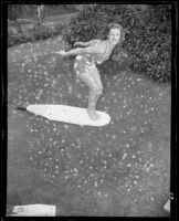 Jean Moorhead posing on a "surfboard," Santa Monica, 1951