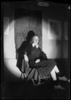 Santa Monica High School Student seated in front of a displayed textile, Santa Monica, 1937-1939