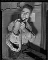 Johanssen Houtenbrink ("Snake Joe"), witness in Mary Emma James murder case, with rattlesnake, 1936
