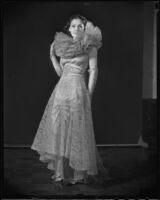 Model Jeannette Warren in lace gown designed by Travis Banton, Times Fashion Show, Los Angeles, 1936