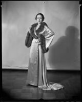 Model Priscilla Lawson in satin and fur negligee, Times Fashion Show, Los Angeles, 1936