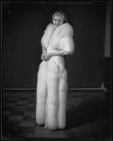 Model Jeannette Warren in fur-trimmed gown, Times Fashion Show, Los Angeles, 1936