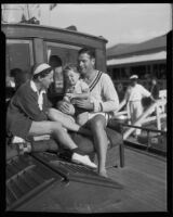 Actors Richard Arlen and Jobyna Ralston Arlen, with son Rickey Arlen, on their boat, Coronado, 1935