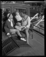 Actors Richard Arlen and Jobyna Ralston Arlen, with son Rickey Arlen, on their boat, Coronado, 1935