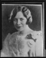 Young woman in dress with flowers at shoulder, photographed by Albert Witzel, [1920s?]