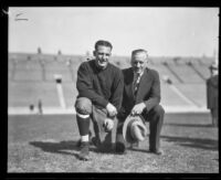 Football player Red Grange and manager C.C. Pyle posing, Los Angeles Coliseum, Los Angeles, 1926