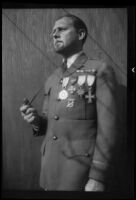 Military pilot recruiter Russell Hearn in (Chinese?) military uniform with medals, 1937