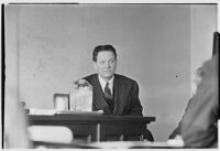 Divorcing husband James A. Cornelius on witness stand, 1938