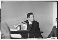 Divorcing husband James A. Cornelius on witness stand, 1938