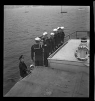 Sea Scouts aboard Pinta, saluting arriving officer, Balboa peninsula (Newport Beach), 1937