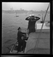 Sea Scouts aboard Pinta, saluting arriving officer, Balboa peninsula (Newport Beach), 1937