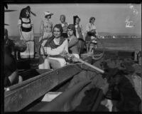 Newport Beach water parade, young women on Long Beach Chamber of Commerce float representing 1932 Olympics, Newport Beach, 1932