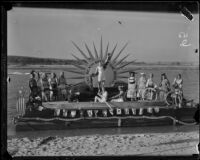Newport Beach water parade, young people on Long Beach Chamber of Commerce float representing 1932 Olympics, Newport Beach, 1932