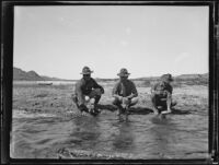 Arizona National Guard members filling canteens at water's edge, Colorado River, near Parker, Arizona, 1934