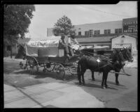 John Boose and W. Hunter Leach on the Santa Ana Breakfast Club chuck wagon during the Fiesta del Oro, Santa Ana, 1933