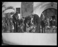 Ceremonial setting of a bronze medallion at the dedication of the Santa Barbara County Courthouse, Santa Barbara, 1929