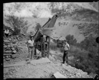 Gold miners M.L. Sims and Archie Clark with mining equipment, San Gabriel Canyon, 1932