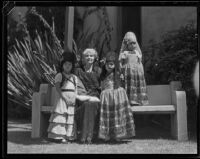 Woman and 3 little girls in Spanish dress at the Old Spanish Days Fiesta, Santa Barbara, 1932