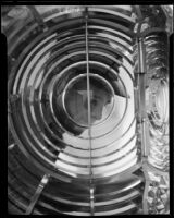 Point Vicente Lighthouse first assistant keeper Thomas A. Atkinson viewed through lighthouse lens, Rancho Palos Verdes, 1935