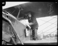Judge William S. Baird standing on airplane wing, [1927?]
