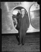 Henry Bern outside airplane, 1932