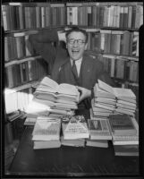 Los Angeles police captain Howard L. Barlow with his book collection, 1935