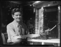 Frank J. Buck, mining engineer and writer, seated at his typewriter, Tujunga (Los Angeles), 1935