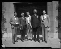 Dr. Briegleb standing with other men outside the First Presbyterian Church of Hollywood, Los Angeles, 1920s