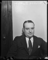 Monroe Butler, seated by a door, Los Angeles, 1933