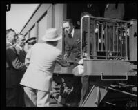 Commander Richard Byrd shakes hands with George O. Noville while disembarking from a train, Los Angeles, 1928