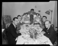 Walter Byron and six other actors seated around a dining table, 1928